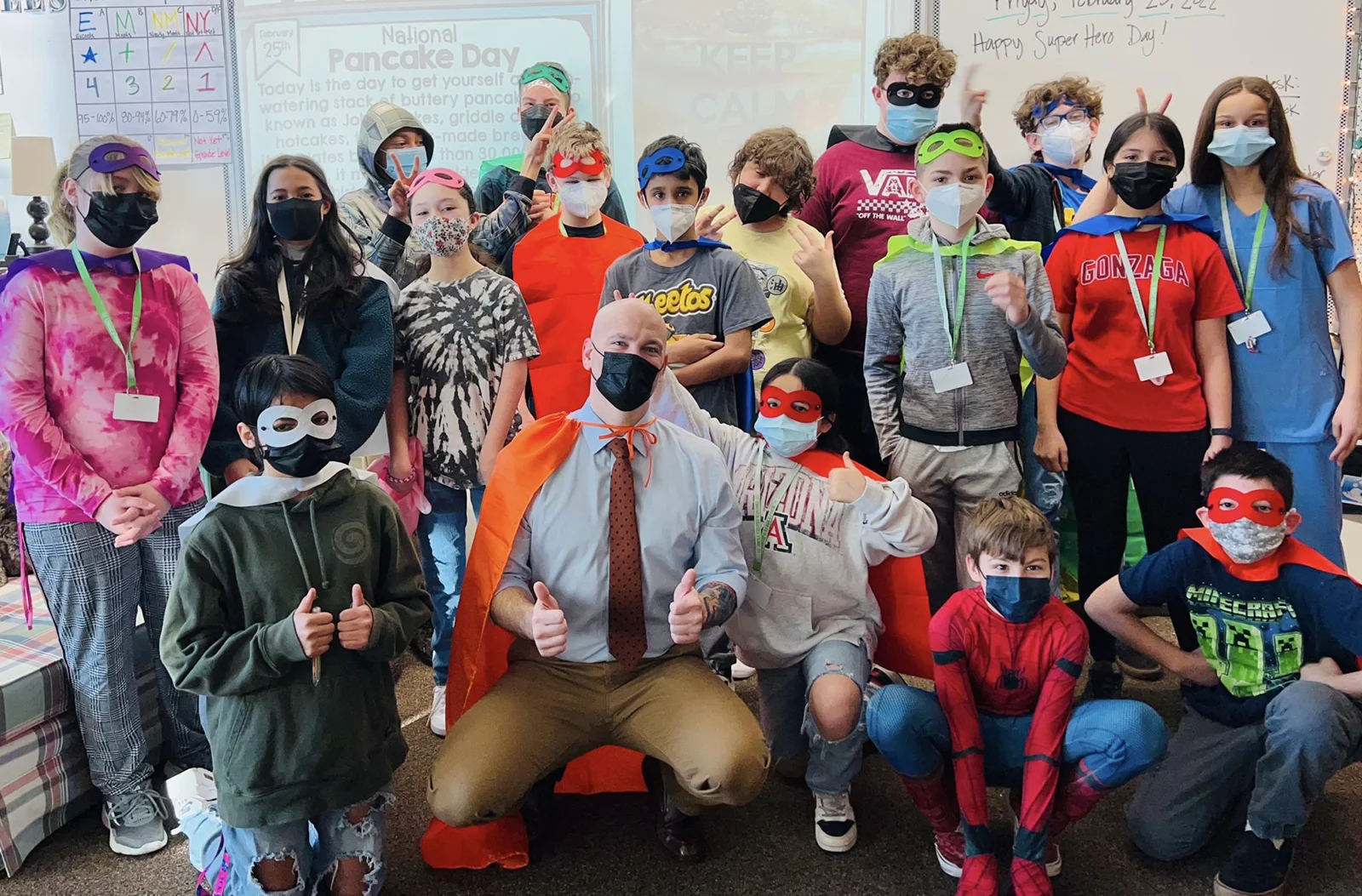 Michael Fuller, Founder of Underdog Law Volunteering with a bunch of kids in costumes.